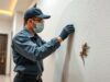 Lizard Control in Hyderabad - Satish Pest Control technician inspecting a home