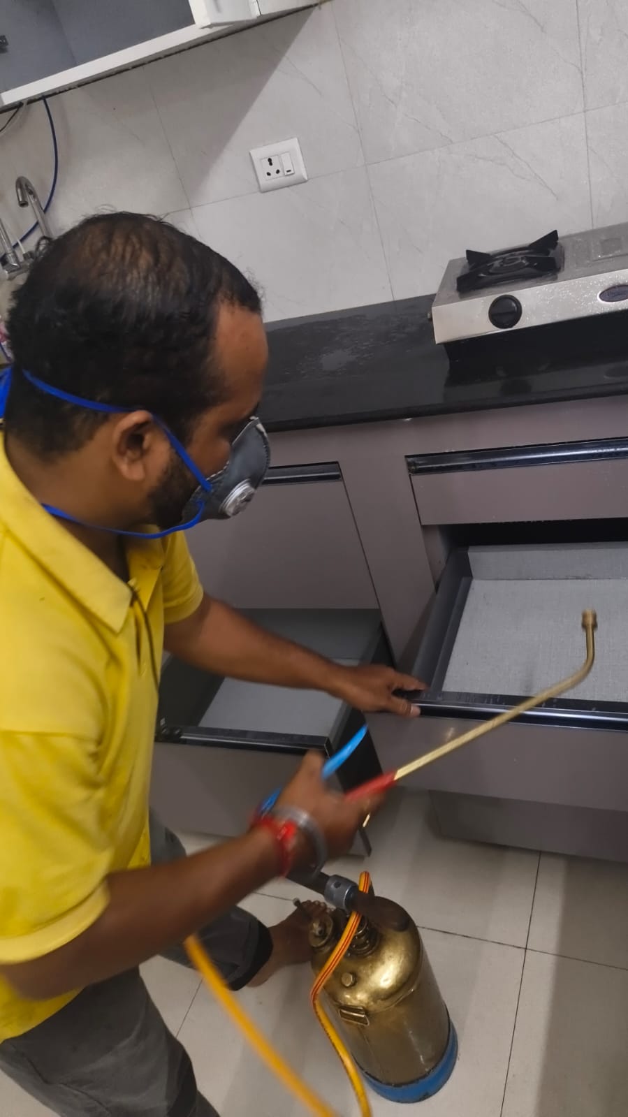 Cockroach gel treatment under modular kitchen drawer, Madhapur apartment